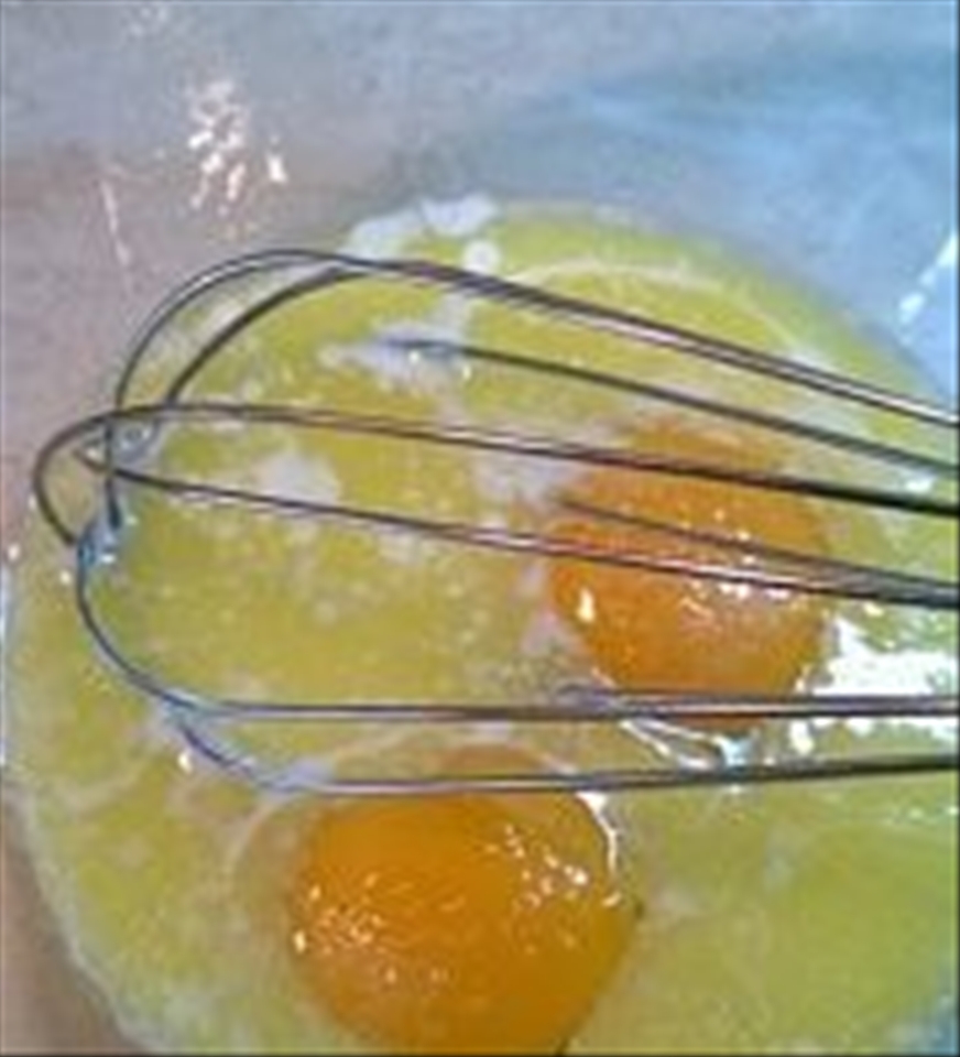 1)	First of all in a bowl, mix eggs with melted but chilled butter.