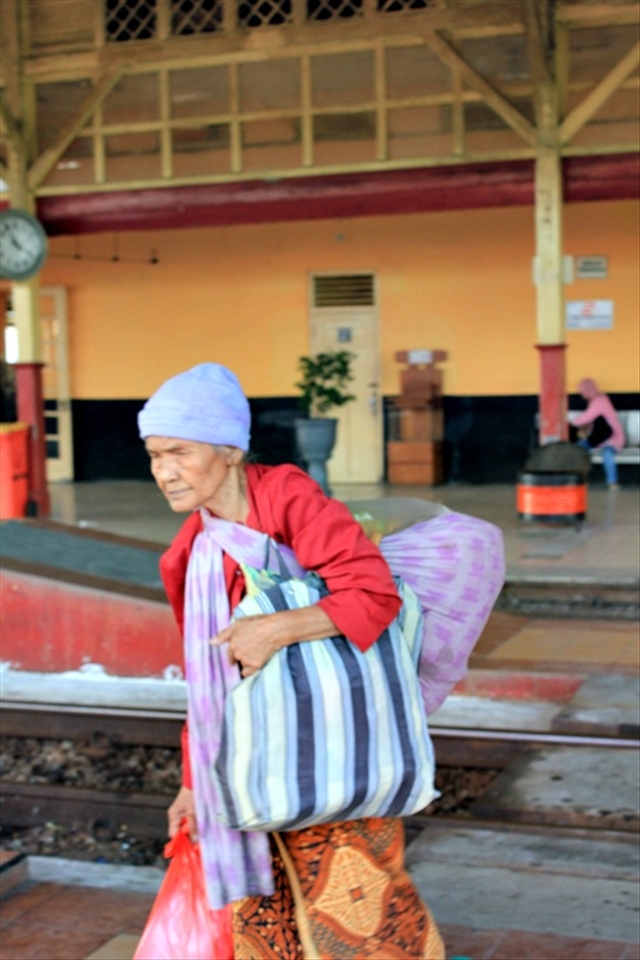 everyday she sell pecel and gorengan (a traditional food from Java).  She went to Cepu rail way station, a small station in East Java.  She waited a train that stop there, usually just less than 3 trains everyday, although She was old, She still want to struggle to survive.  The carrying was heavy, but She must walk so far to arrive at the station, waiting the buyer to get money that just enough for eat, but she said to me 