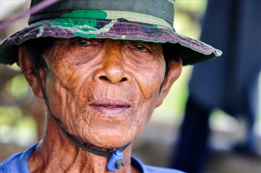 Old man was working on a rice field everyday from 6.00 till 22.00. I asked him to pose for me and then I took this shot. Man was very happy that someone noticed him.