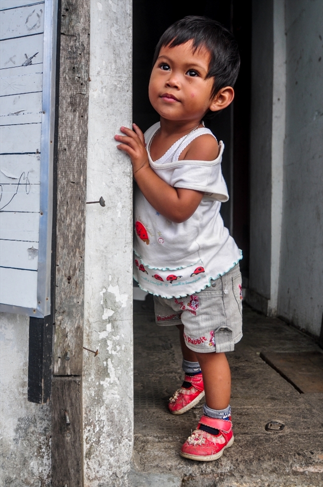 Photo of this young girl was taken in a local village market, and my girlfriend noticed that she was there crying so she went to her to make her feel better. After a while a girl stopped crying and I have taken a photo.