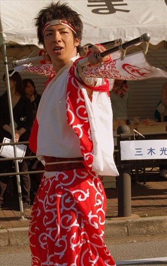 In the small town of Midorigaoka, a young man participates in the yearly village festival, happy to be part of the tradition