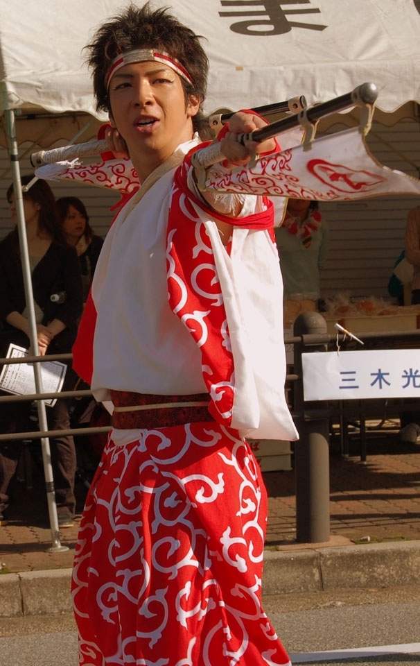 In the small town of Midorigaoka, a young man participates in the yearly village festival, happy to be part of the tradition