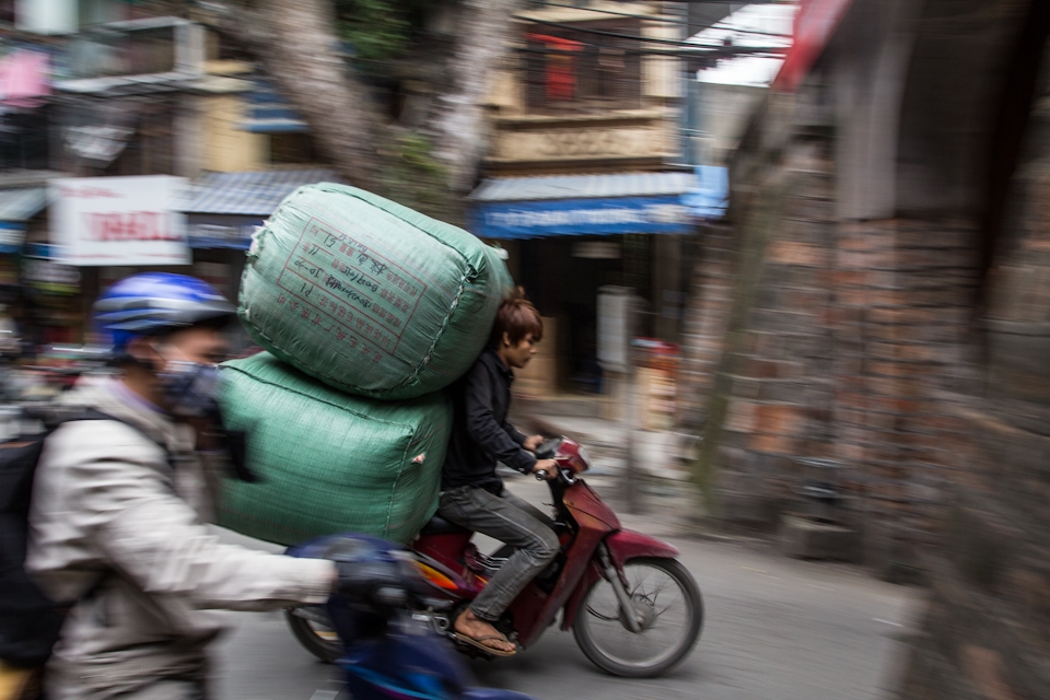 Hanoi runs on motorcycles. Cargos exceed all imagination. 