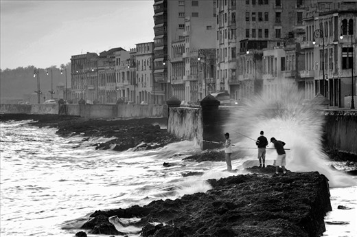 Fishermans in the main attraction of Havana, the Malecon