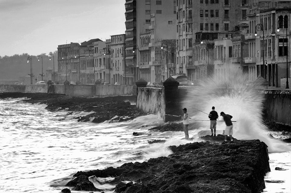 Fishermans in the main attraction of Havana, the Malecon