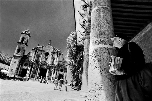 Book seller in the Cathedral square in the downtown of Havana