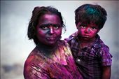Holi is a flamboyant festival where coloured powder or watercolours are thrown on one another in celebration of the beginning of spring. 
Featured here is a mother and her child after hours of having been doused in the colour. : by zosogis, Views[1262]