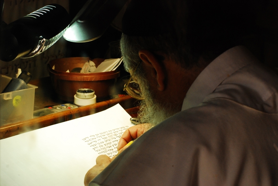 Ancient Inspiration:
This rabbi ventures to one of the oldest synagogues in Israel at the top of Masada. It is here, he finds inspiration to undertake the sacred act of copying biblical Hebrew text.