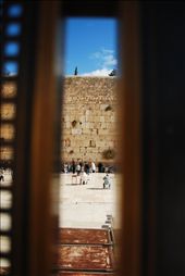 Spying on the Wailing Wall:
In Hebrew tradition, men and women pray separately to help prevent distraction. An obscure view through a fence is the best view a woman can get of the men’s section.: by zpaley, Views[265]