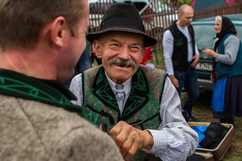 Elder secler (szekely) man in traditional clothes making business using his wits and charming personality.To give an example for his sharp sense of humour. When a young lady, looking at the trade asked the old man: 