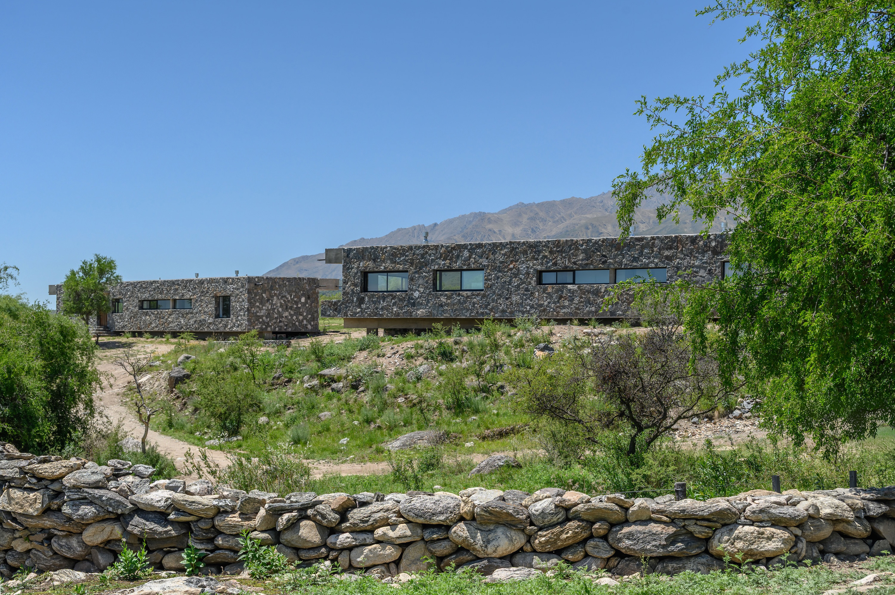 Gravity Held in Stone – Suspended Stone Houses by Paul Dragicevic