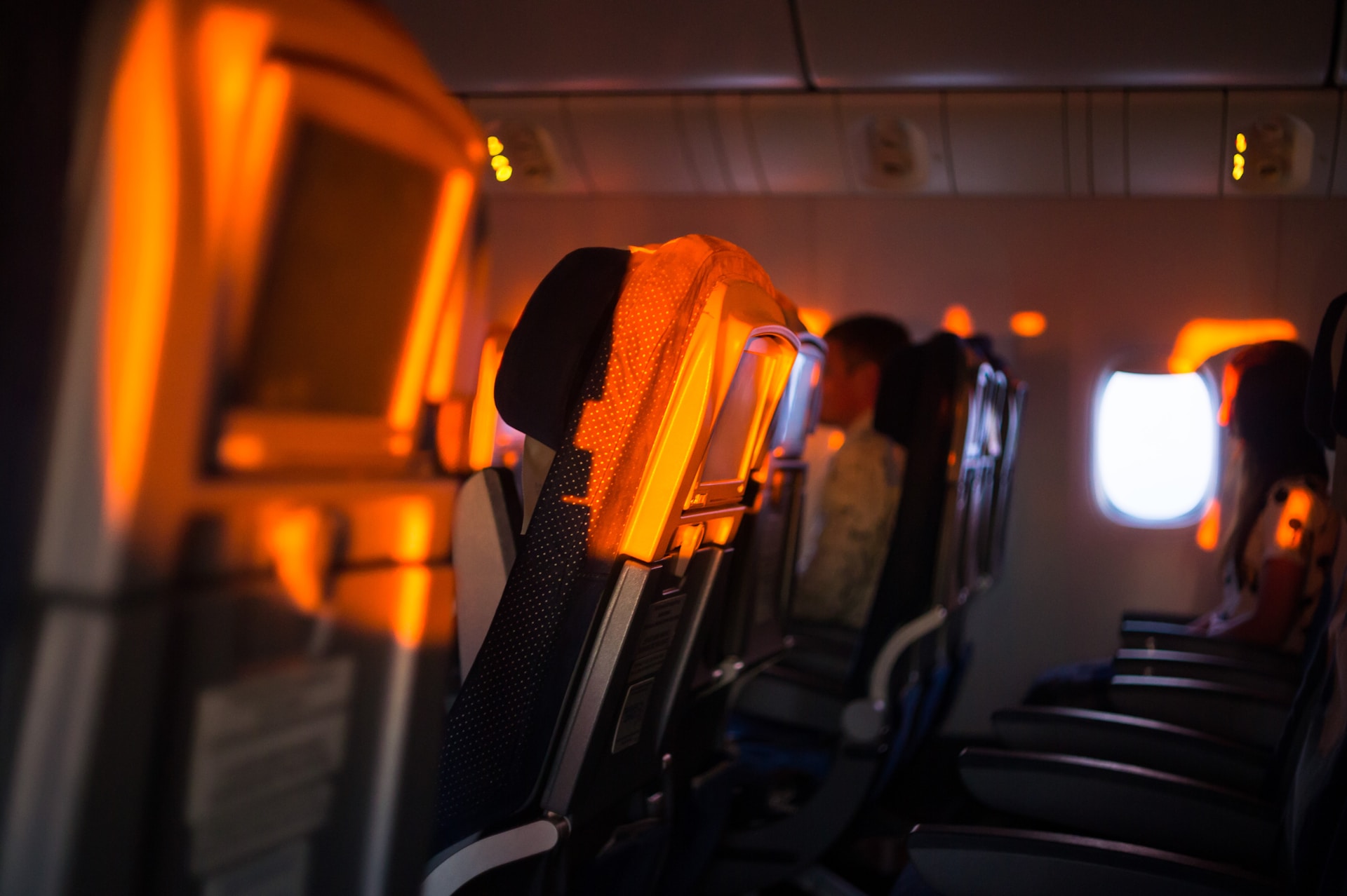 The seats of a quiet plane during sunset