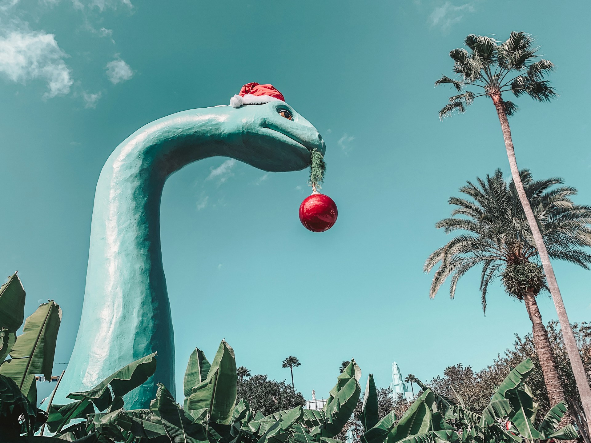 A Christmas-themed dinosaur statue at Disney World, Florida