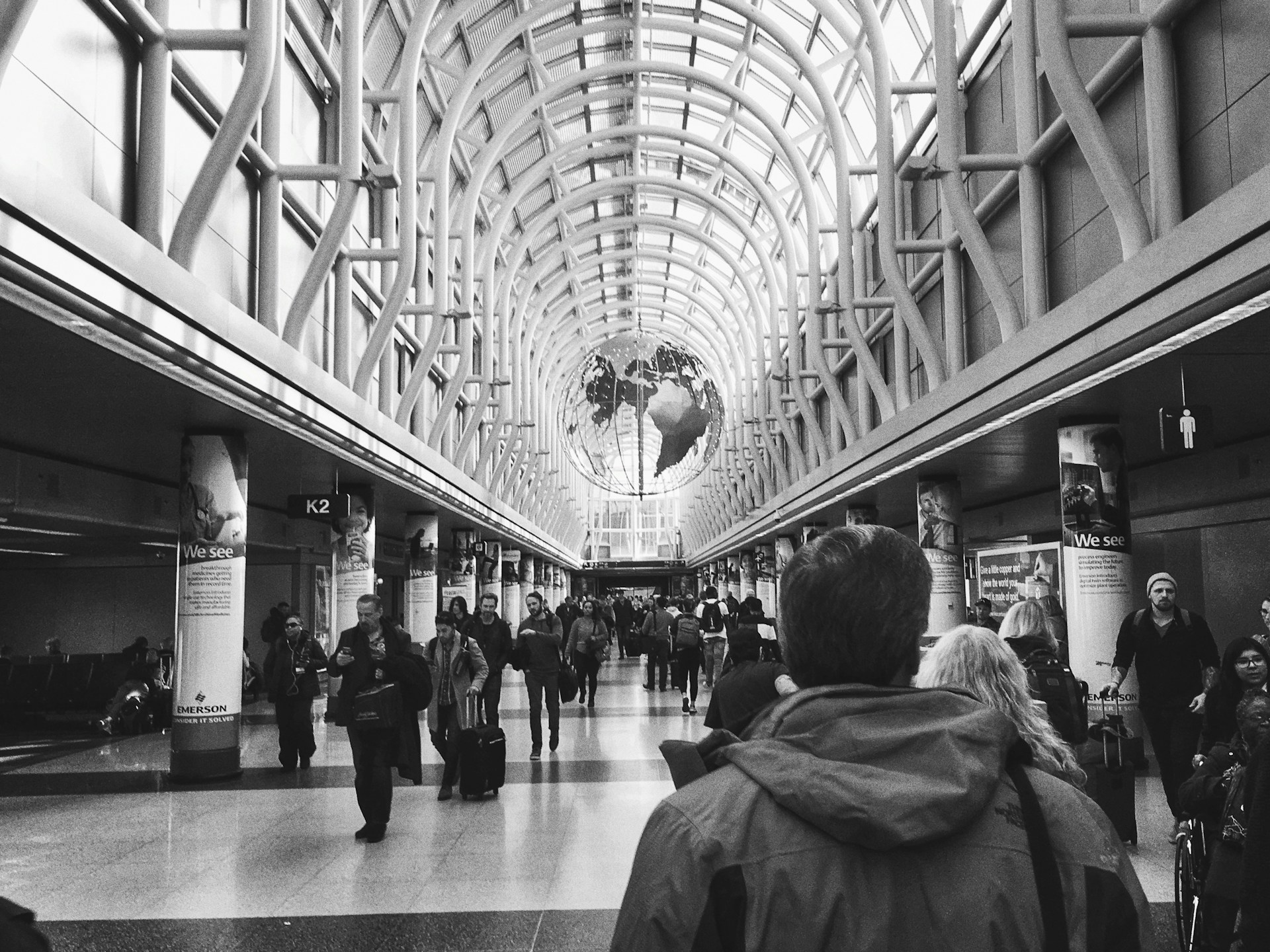 People walking inside O'Hare Airport terminal