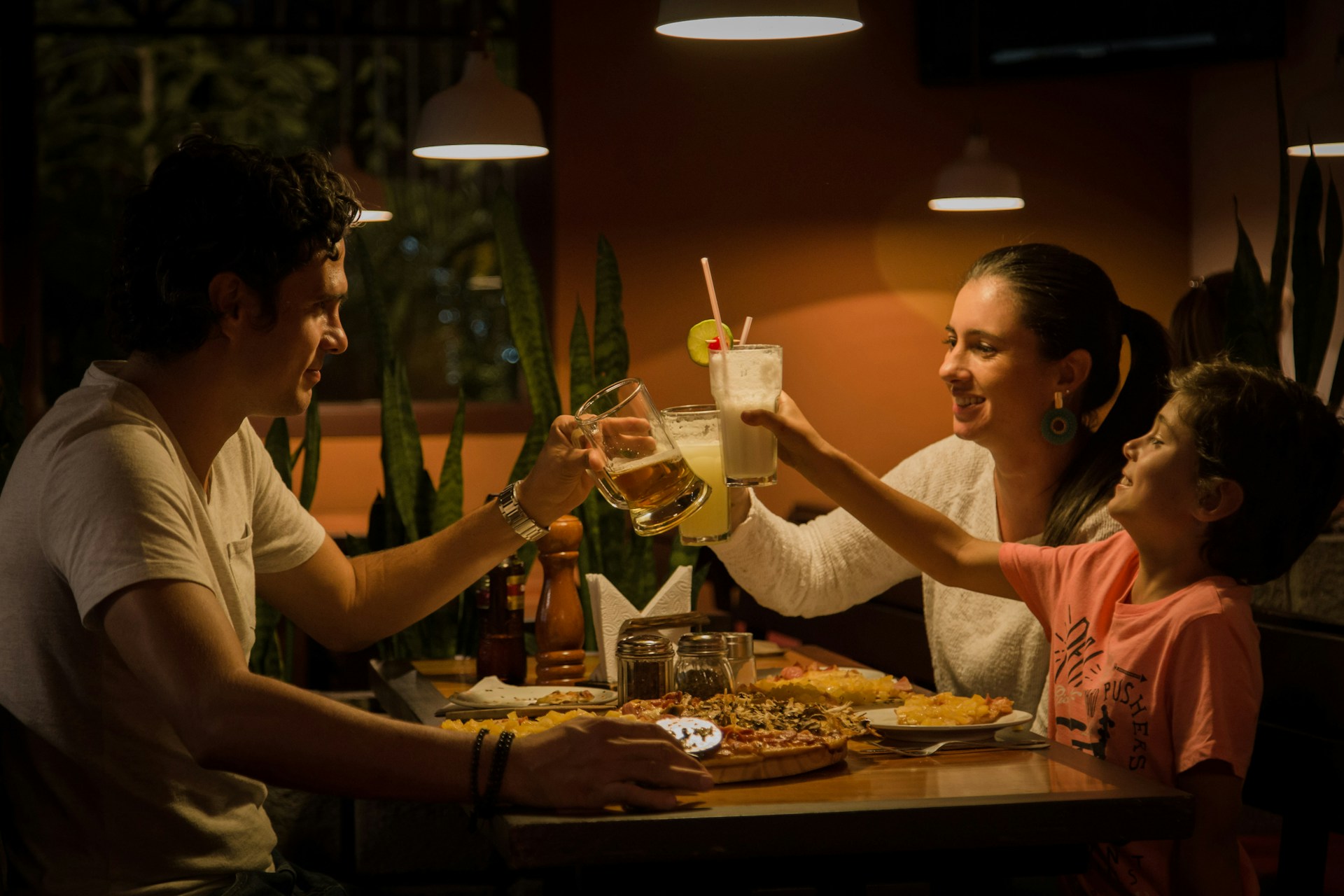 A family sitting around a table enjoying dinner