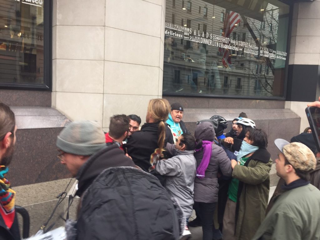 An evangelist preacher clashes with protesters at 14th and F Street NW.