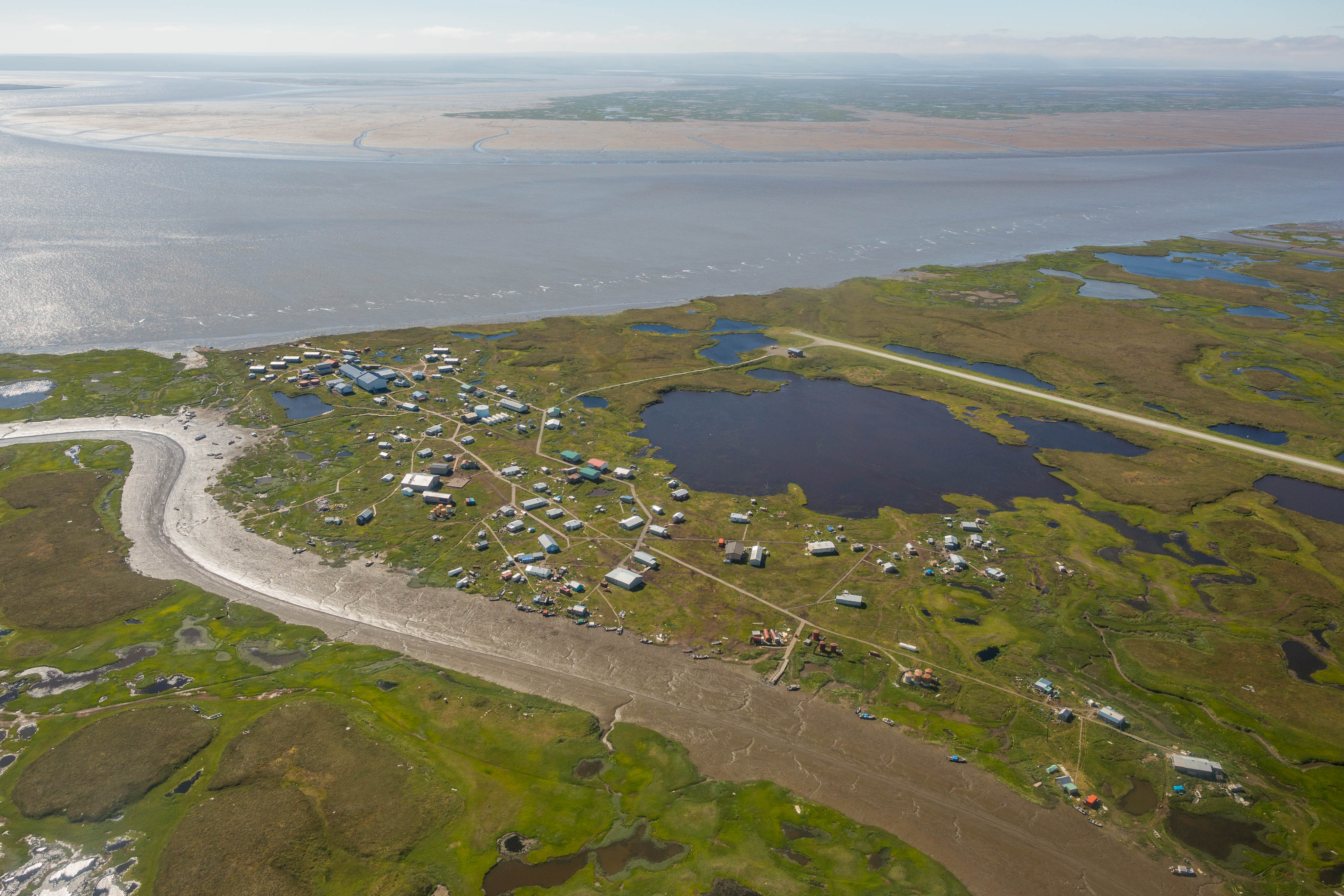 The village of Newtok, in southwest Alaska, on Tuesday, August 4, 2015. The community has lost 3 miles of shoreline to the Ninglick River over the past 60 years, and is in the process of moving to a new site on higher ground 9 miles away. (Loren Holmes / Alaska Dispatch News)