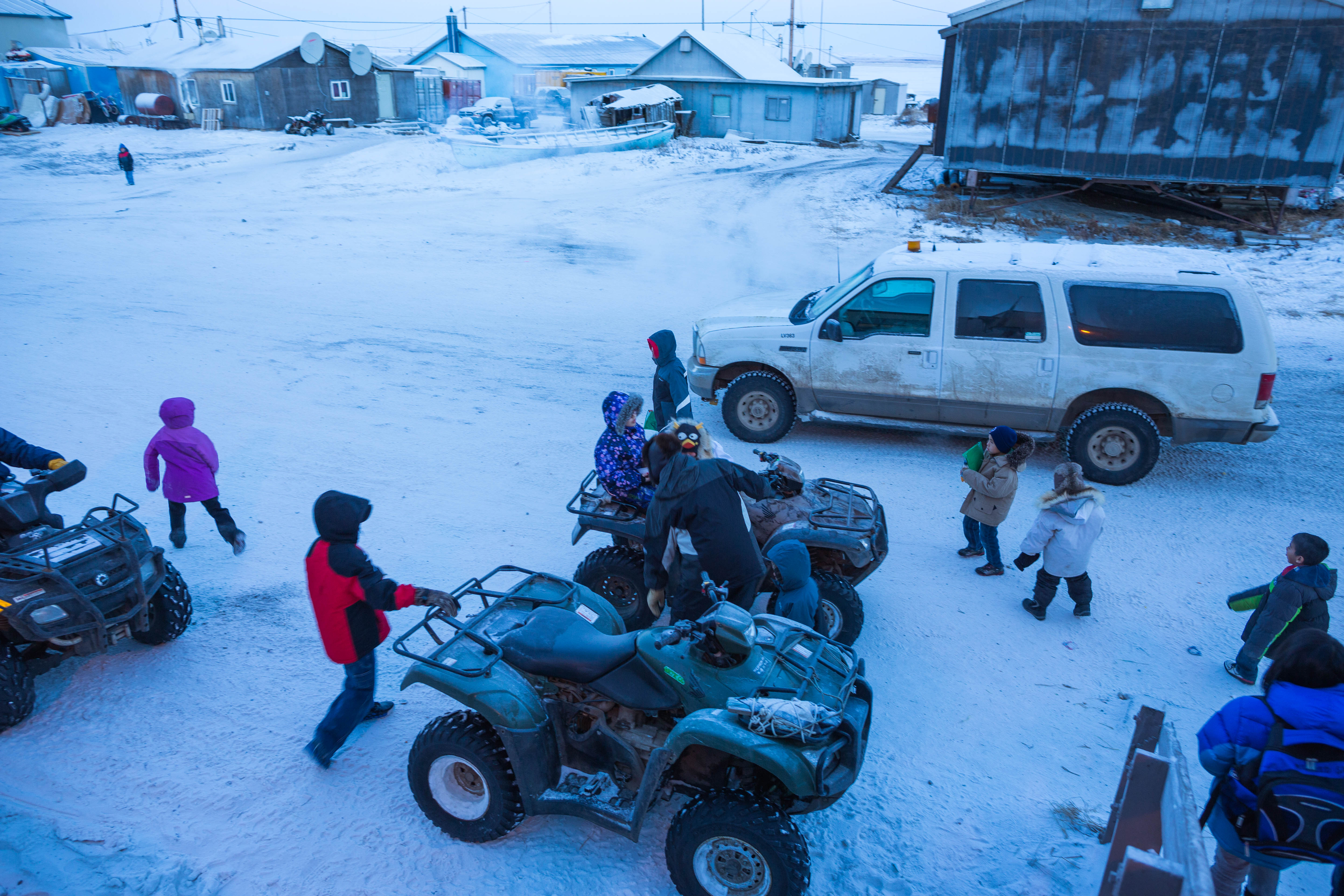 Children leave Kivalina's McQueen School after classes on Dec. 11, 2012. (Loren Holmes / Alaska Dispatch News)