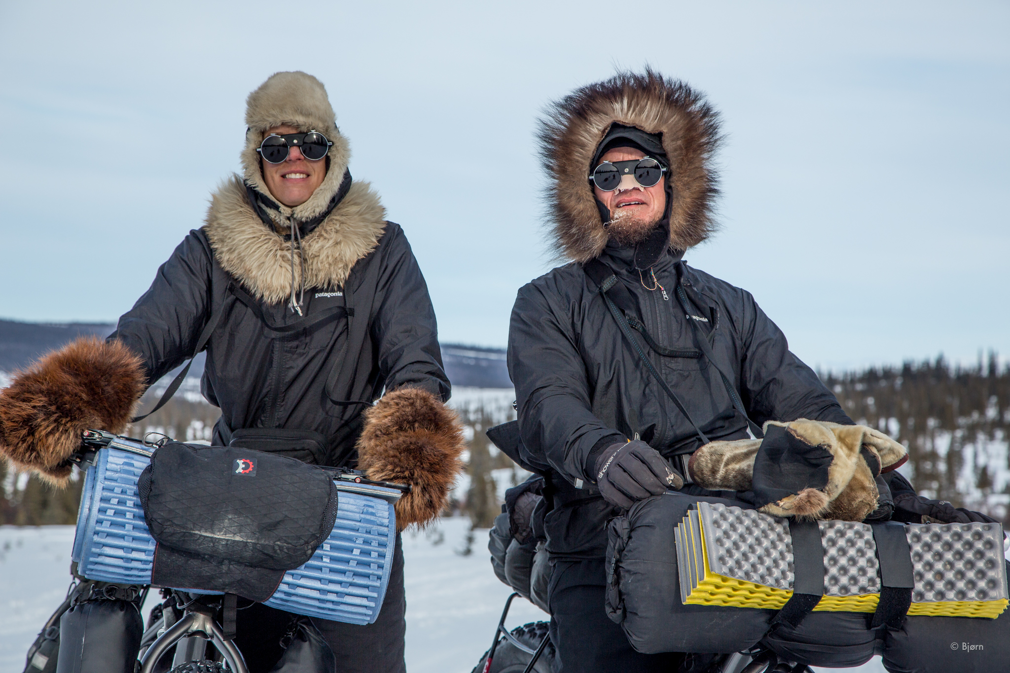 Bjørn Olson and Kim McNett pause to have their photo taken by Iditarod walker, Klaus Schweinberger, outside the village of Koyuk in March 2016. (Klaus Schweinberger)