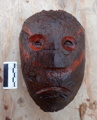 This wooden head, perhaps for a doll, was found at the base of a wall at the Nunalleq archaeological site near Quinhagak. (Rick Knecht)