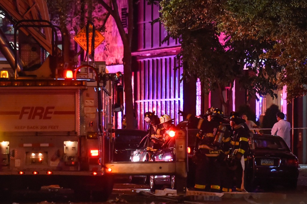 New York City firefighters stand near the site of an explosion in the Chelsea neighborhood of Manhattan, New York September 17, 2016. REUTERS/Rashid Umar Abbasi