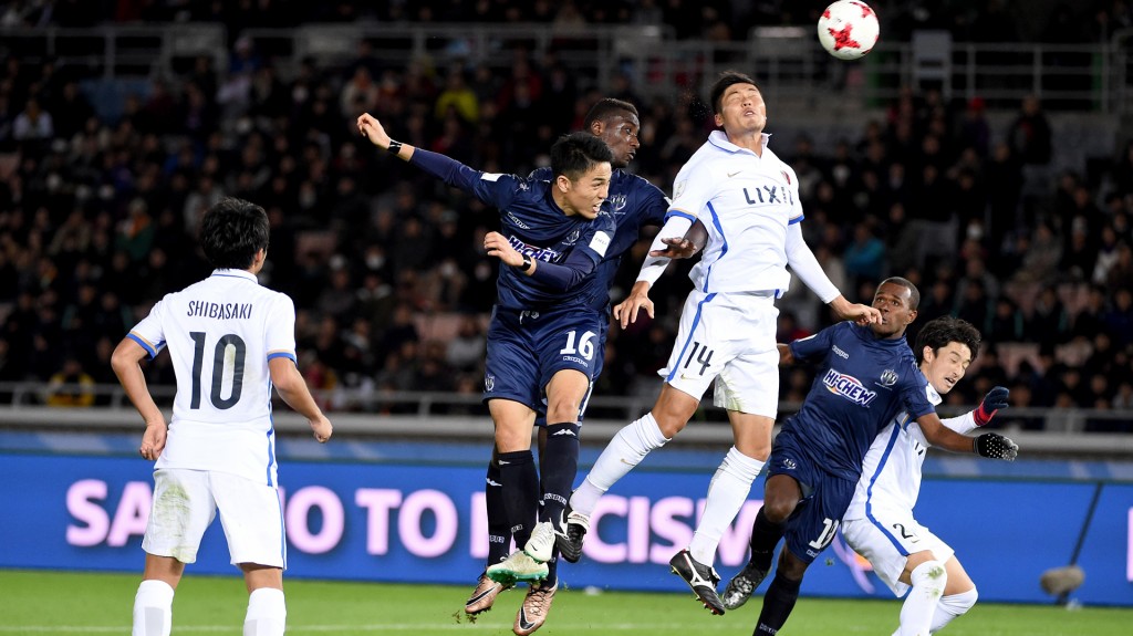 Kashima Antlers defender Hwang Seok-Ho (3rd R) battles for the ball with Auckland City defender Kim Daewook (2nd L) during the Club World Cup football match between Auckland City and the Kashima Antlers in Yokohama on December 8, 2016. / AFP PHOTO / Toru YAMANAKA