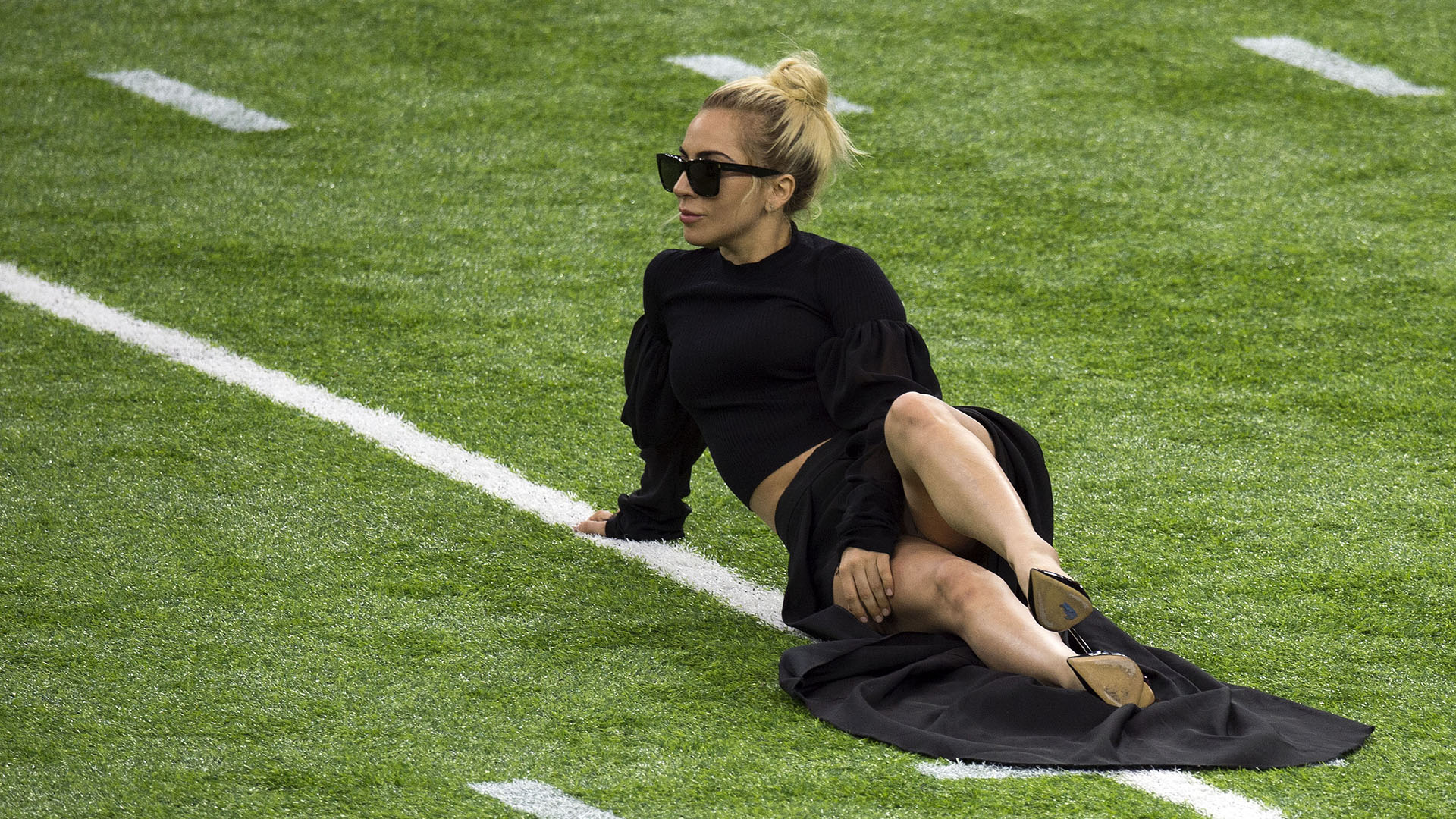 Singer Lady Gaga poses on the field at the Super Bowl LI before the start of the game at Houston NRG Stadium in Houston, Texas, on February 5, 2017. / AFP PHOTO / VALERIE MACON