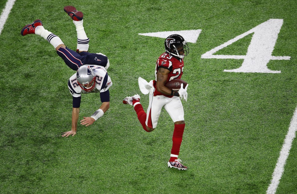 HOUSTON, TX - FEBRUARY 05: Tom Brady #12 of the New England Patriots attempts to tackle Patrick Chung #23 of the New England Patriots after an interception in the second quarter during Super Bowl 51 at NRG Stadium on February 5, 2017 in Houston, Texas. (Photo by Ezra Shaw/Getty Images)