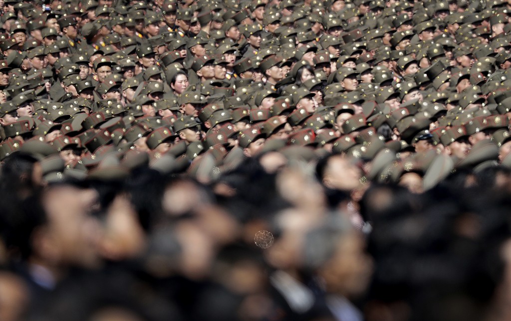 Thousands of North Korean men, women as well as soldiers gather at the Ryomyong residential area, a collection of more than a dozen apartment buildings, to attend its official opening ceremony on Thursday, April 13, 2017, in Pyongyang, North Korea. (AP Photo/Wong Maye-E)