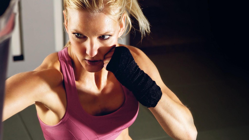 CFKP2D Young adult fitness woman boxing in a gym