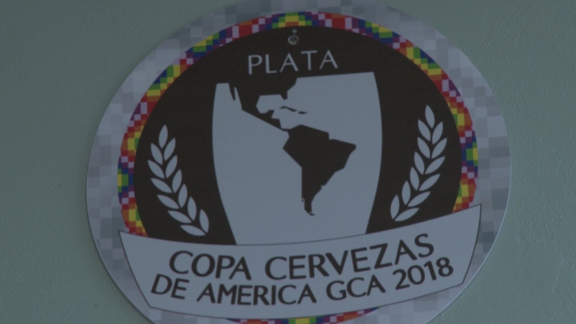 Una de las medallas ganadas por la cervecería en la Copa América de este año