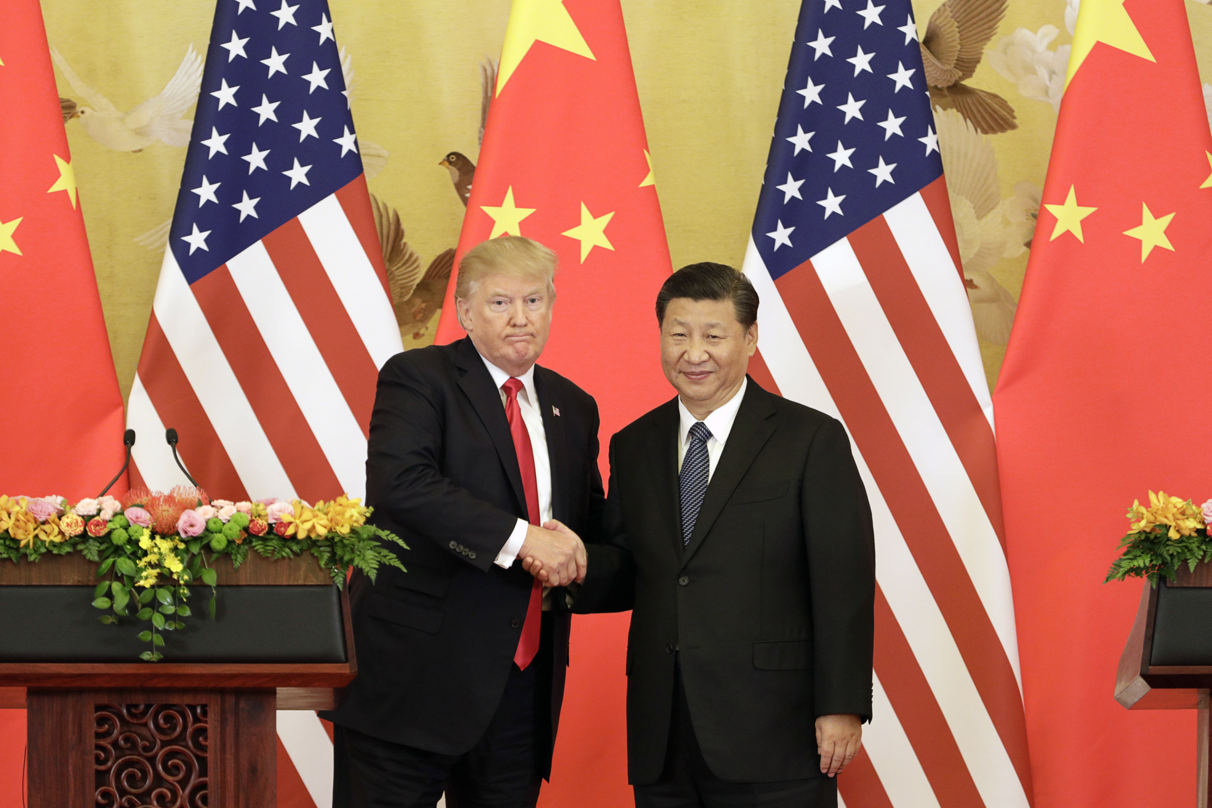 President Donald Trump and Xi Jinping, China’s president, shake hands during a news conference at the Great Hall of the People in Beijing on Nov. 9, 2017. Bloomberg photo by Qilai Shen.