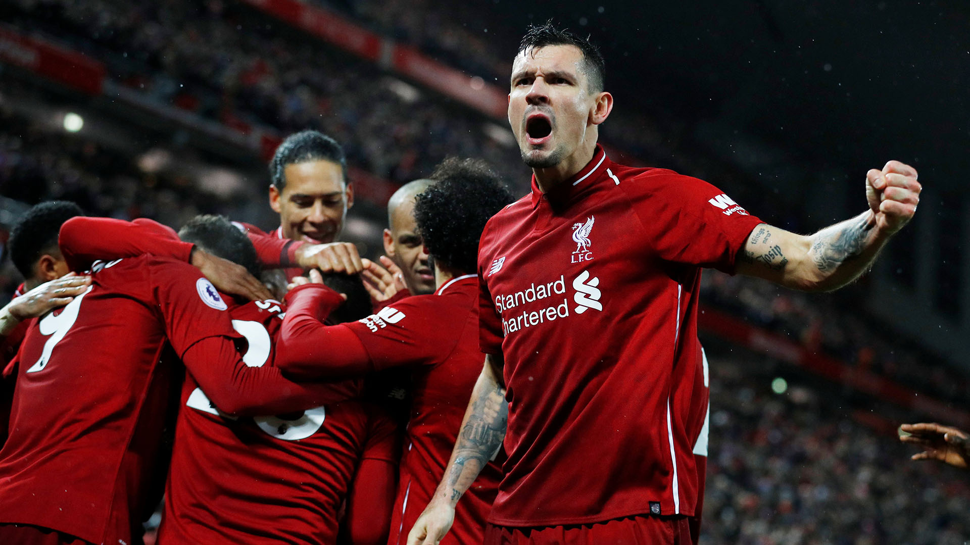 Soccer Football – Premier League – Liverpool v Manchester United – Anfield, Liverpool, Britain – December 16, 2018 Liverpool’s Xherdan Shaqiri celebrates scoring their third goal with Dejan Lovren and team mates REUTERS/Phil Noble EDITORIAL USE ONLY. No use with unauthorized audio, video, data, fixture lists, club/league logos or “live” services. Online in-match use limited to 75 images, no video emulation. No use in betting, games or single club/league/player publications. Please contact your account representative for further details.