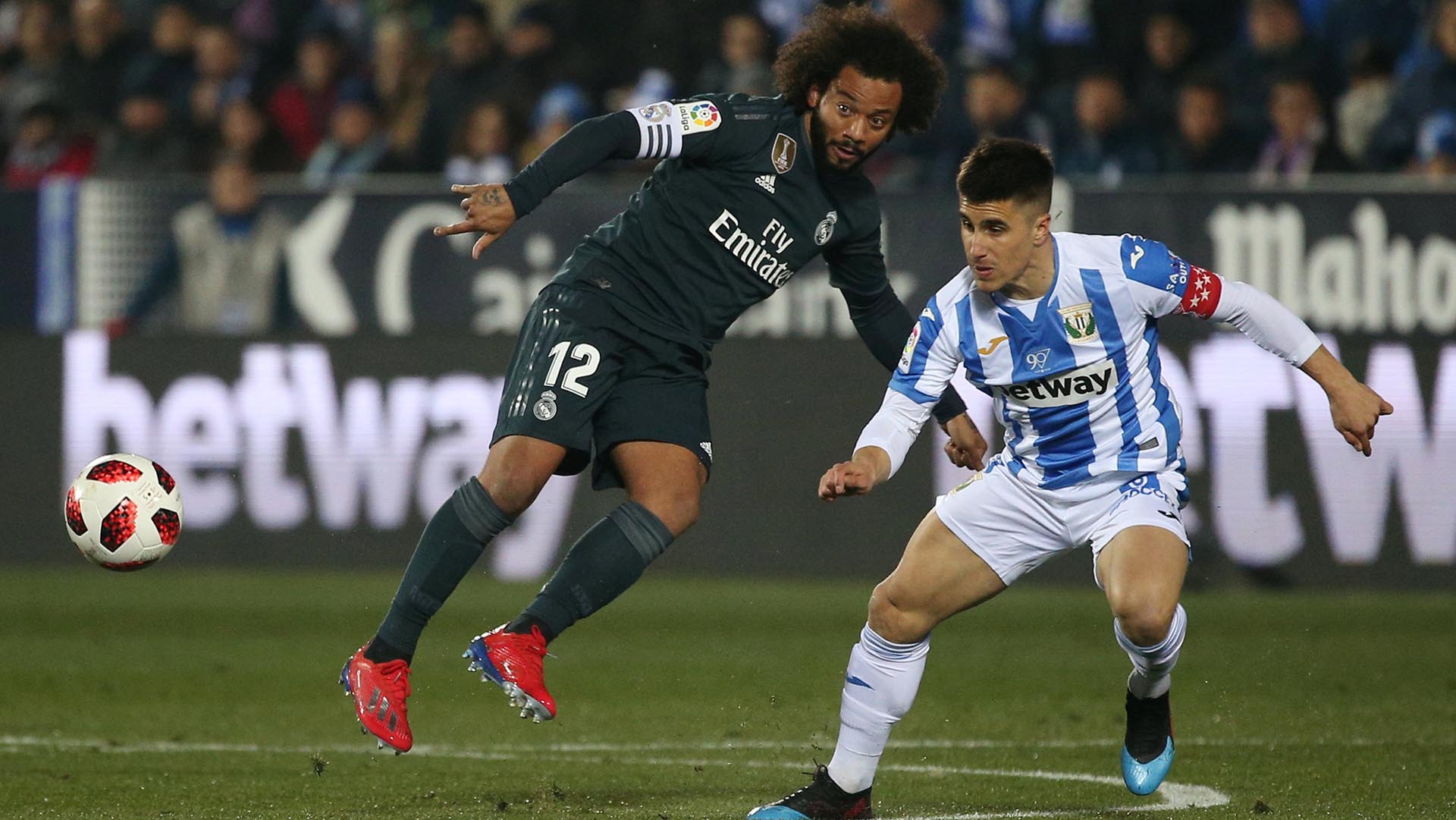Soccer Football – Copa del Rey – Round of 16 – Second Leg – Leganes v Real Madrid – Butarque Municipal Stadium, Leganes, Spain – January 16, 2019 Leganes’ Unai Bustinza in action with Real Madrid’s Marcelo REUTERS/Javier Barbancho