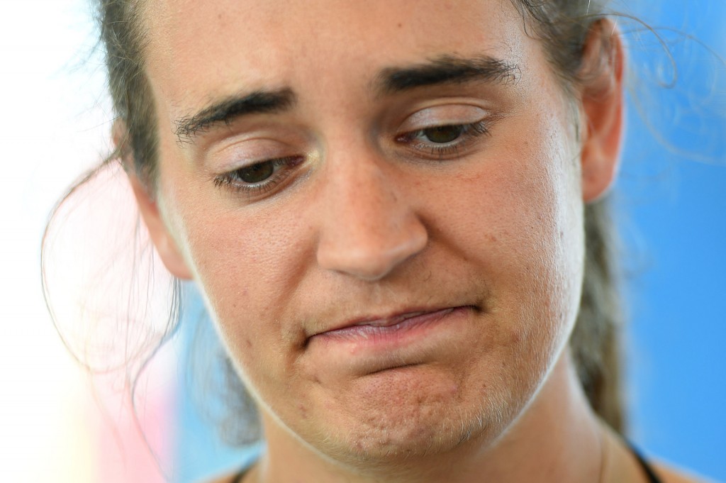 Carola Rackete, captain of rescue ship Sea-Watch 3, reacts as she speaks to the media as the ship remains blocked one mile outside the port of Lampedusa, Italy, June 27, 2019. REUTERS/Guglielmo Mangiapane