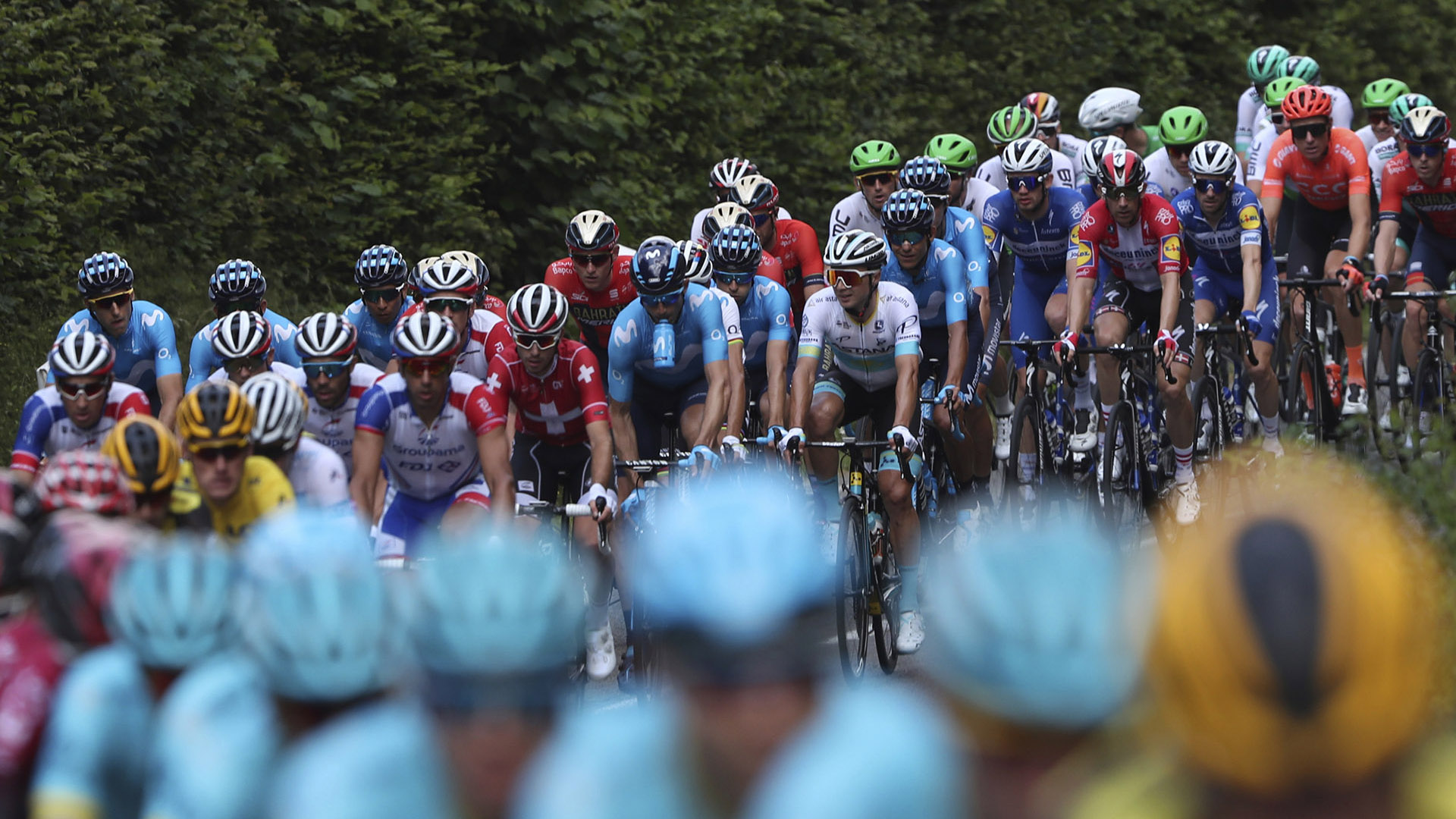 The pack rides during the third stage of the Tour de France cycling race over 215 kilometers (133,6 miles) with start in Binche and finish in Epernay, Monday, July 8, 2019. (AP Photo/Thibault Camus)