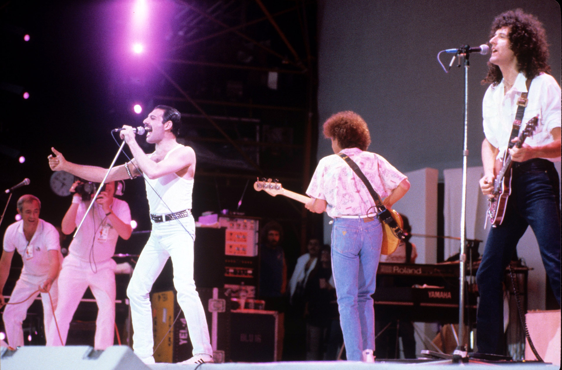 Freddie Mercury, John Deacon y Brian May en el Live Aid en 1985 (Shutterstock)