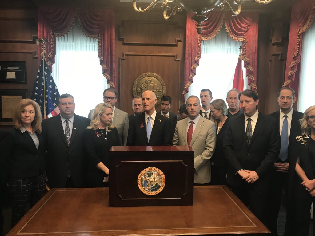 Florida Gov. Rick Scott signed new gun restrictions Friday in response to last month's massacre that took 17 lives at Marjory Stoneman Douglas High School in Parkland. [SCOTT KEELER | Times]