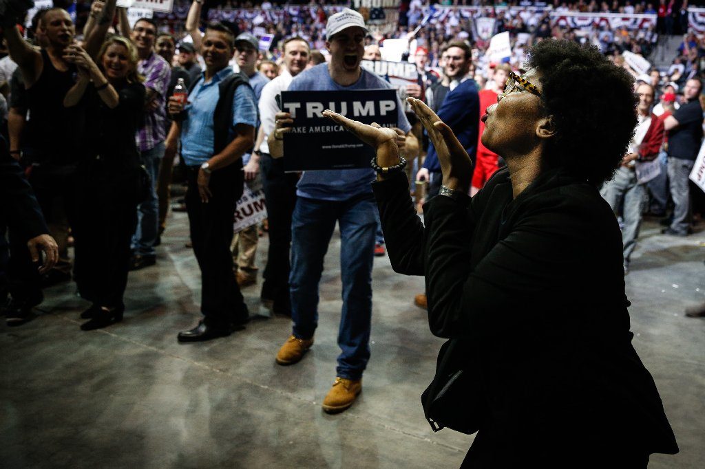 A protester blows a kiss while being kicked out of a Donald Trump rally during his presidential campaign at the University of South Florida Sun Dome in Tampa in 2016. [LOREN ELLIOTT | Times]