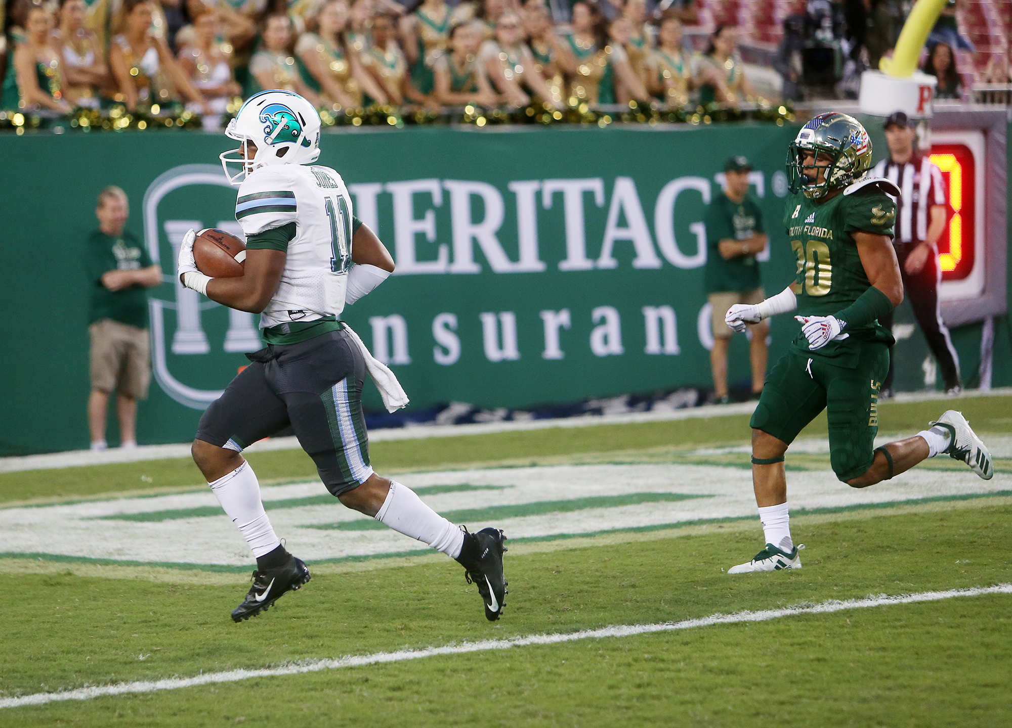 Tulane running back Amare Jones (11) runs for a touchdown past USF defensive back Bentlee Sanders on Nov. 3. (OCTAVIO JONES | Times) Tulane running back Amare Jones (11) runs for a touchdown past USF defensive back Bentlee Sanders on Nov. 3. (OCTAVIO JONES | Times)