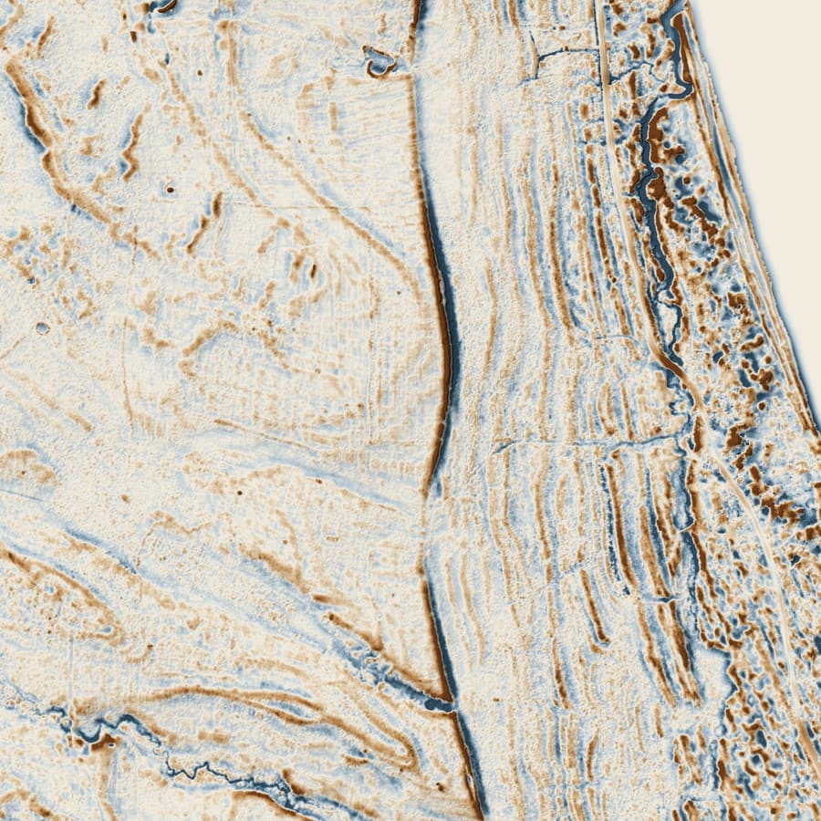 Relief plate of The unexplained north-south lane: a shaded local-relief model of a frame 1,400 m across, drawn from bare-earth LiDAR. Cuts below the local mean are blue, fills above it brown.
