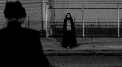 A GIRL WALKS HOME ALONE AT NIGHT 