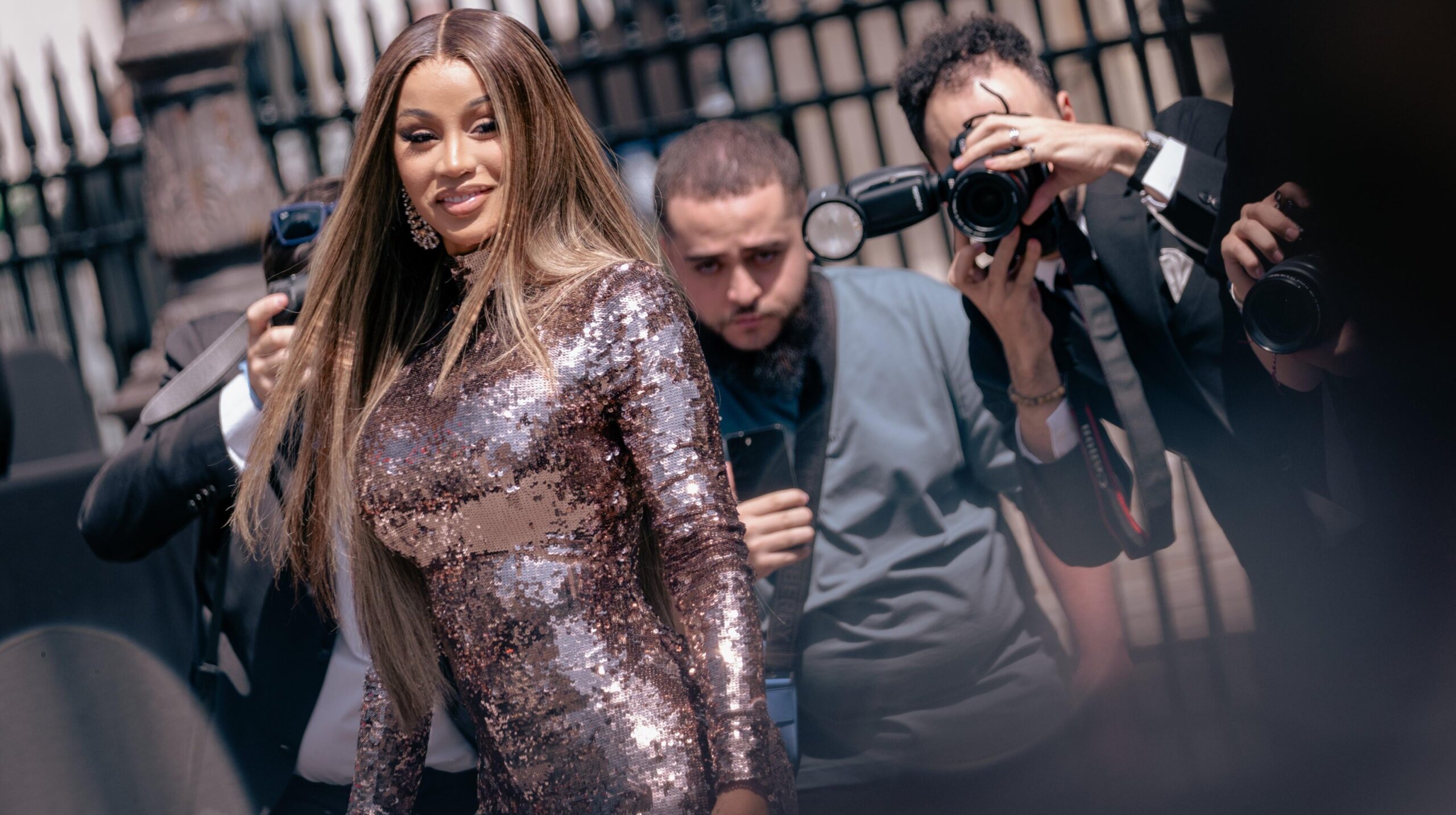 Cardi B wears a long sleeves bronze sequins dress, outside Fendi, during the Haute Couture Fall/Winter 2023/2024 as part of Paris Fashion Week on July 06, 2023 in Paris, France. Photo: Getty Images Claudio Lavenia