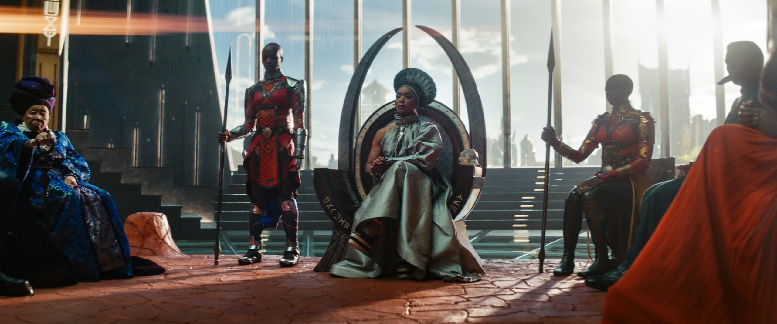 (L-R): Dorothy Steel as Merchant Tribe Elder, Florence Kasumba as Ayo, Angela Bassett as Ramonda, Danai Gurira as Okoye in Marvel Studios’ Black Panther: Wakanda Forever. Photo: Marvel Studios