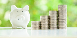 piggy bank with stacks of coins