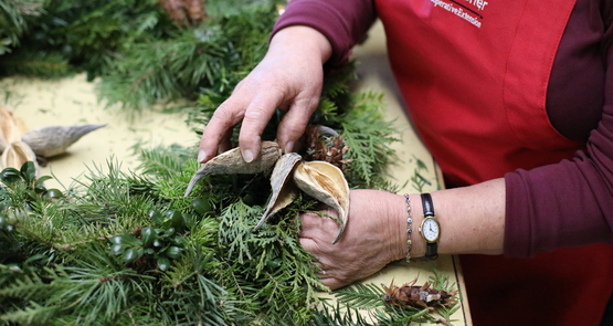 Master Gardener working on a holiday wreath