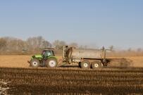 Tractor delivering slurry onto a field