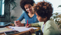 parent helping child with homework