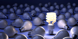 CFL lightbulb surrounded by incandescent bulbs (NOTE: this is used by CCE-Tompkins as the image for $ave Energy, Save Dollars workshops)