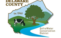 Ourline of Delaware County NY with a cow grazing beneath a tree, and text stating Delaware County Soil & Water Conservation District established 1946
